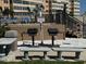 Outdoor grilling area with stone benches and well-maintained equipment perfect for resident gatherings and community events at 5108 Brittany S Dr # 903, St Petersburg, FL 33715