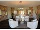 Inviting lobby area with comfortable seating, modern lighting, and stylish decor in a well-maintained space at 5108 Brittany S Dr # 903, St Petersburg, FL 33715
