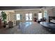 Spacious resident lounge featuring a fireplace, comfortable seating and access to an outdoor area at 5108 Brittany S Dr # 903, St Petersburg, FL 33715