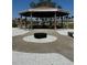 Outdoor pavilion featuring picnic tables and a fire pit, ideal for community gatherings and outdoor enjoyment at 5108 Brittany S Dr # 903, St Petersburg, FL 33715