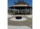 Outdoor pavilion featuring picnic tables and a fire pit, ideal for community gatherings and outdoor enjoyment at 5108 Brittany S Dr # 903, St Petersburg, FL 33715