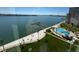 A beautiful resort pool with palm trees and a bay view at 5108 Brittany S Dr # 903, St Petersburg, FL 33715
