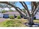 Cozy home with mature tree in the front yard provides shade and character to the property at 7960 2Nd N St, St Petersburg, FL 33702