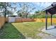 Backyard with wooden fence and green grass at 8308 N Mulberry St, Tampa, FL 33604
