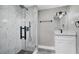 Sleek bathroom with a glass-enclosed shower featuring modern fixtures and elegant tile work at 8308 N Mulberry St, Tampa, FL 33604