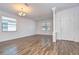 Bright, open-concept living room with wood-look tile flooring and natural light at 831 Vino Verde Cir, Brandon, FL 33511