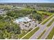 Aerial view of the community pool, clubhouse, parking lot and surrounding community at 8436 White Poplar Dr, Riverview, FL 33578