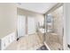 Bathroom features a glass enclosed shower and tile floors at 8436 White Poplar Dr, Riverview, FL 33578