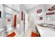 Bathroom featuring a toilet, tub/shower with a Buckeye themed decor and accessories at 8436 White Poplar Dr, Riverview, FL 33578