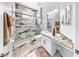 Bathroom featuring a marble shower, marble floors, and granite vanity at 8436 White Poplar Dr, Riverview, FL 33578