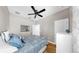 Bedroom with wood floors, light walls, and white trim at 8436 White Poplar Dr, Riverview, FL 33578