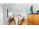 Cozy bedroom with wood floors, ceiling fan, and a double closet at 8436 White Poplar Dr, Riverview, FL 33578