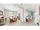 Elegant dining room with tiled floors, stylish furnishings, and ample natural light, perfect for gatherings at 8436 White Poplar Dr, Riverview, FL 33578