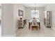 Dining room featuring decorative light fixture, and dining set with matching side cabinets at 8436 White Poplar Dr, Riverview, FL 33578