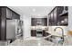 Beautiful kitchen featuring granite countertops, stainless steel appliances, and ample cabinet space at 8436 White Poplar Dr, Riverview, FL 33578