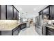 Modern kitchen featuring stainless steel appliances, granite countertops, and an open layout at 8436 White Poplar Dr, Riverview, FL 33578