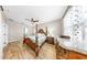 Spacious main bedroom featuring a decorative ceiling fan and light wood flooring at 8436 White Poplar Dr, Riverview, FL 33578