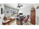 Comfortable home office with hardwood floors, ceiling fan, and natural light from large window at 8436 White Poplar Dr, Riverview, FL 33578