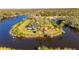 A park with playground equipment next to a waterway with a shelter at 8611 Parkway Cir, Riverview, FL 33569