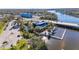 Aerial view of waterfront commercial property, featuring docks, ample parking, and picturesque surroundings at 8611 Parkway Cir, Riverview, FL 33569