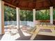 The pavilion has a picnic table, with brickwork and white beams at 8630 Mallard Reserve Dr # 203, Tampa, FL 33614