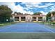 Community tennis court with blue surface and green trim situated near garden style condos in a lush setting at 8630 Mallard Reserve Dr # 203, Tampa, FL 33614