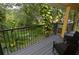 Peaceful balcony overlooking lush greenery, with seating for outdoor enjoyment at 8642 Mallard Reserve Dr # 203, Tampa, FL 33614