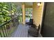 Cozy balcony with chairs and a table perfect for enjoying the outdoors at 8642 Mallard Reserve Dr # 203, Tampa, FL 33614
