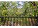 Relaxing balcony view overlooking a lush and vibrant wooded area at 8642 Mallard Reserve Dr # 203, Tampa, FL 33614