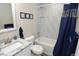 Charming bathroom with a combination shower and tub, decorative tiles, and granite countertops at 8642 Mallard Reserve Dr # 203, Tampa, FL 33614