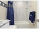 Bathroom view featuring a combination shower and tub, decorative tiles, and granite countertops at 8642 Mallard Reserve Dr # 203, Tampa, FL 33614