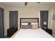 Relaxing bedroom with a large headboard, neutral colors, and matching nightstands at 8642 Mallard Reserve Dr # 203, Tampa, FL 33614