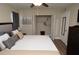 Inviting bedroom offering closet with shelving, dresser, and modern ceiling fan at 8642 Mallard Reserve Dr # 203, Tampa, FL 33614