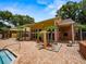 Attractive clubhouse exterior featuring brick accents, large windows, and professional landscaping at 8642 Mallard Reserve Dr # 203, Tampa, FL 33614