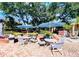 Outdoor courtyard with tables, chairs, and umbrellas offers a relaxing space for residents to gather and socialize at 8642 Mallard Reserve Dr # 203, Tampa, FL 33614