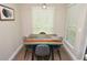 Dining area with a unique wood and blue resin dining table, seating for four, and bright natural light at 8642 Mallard Reserve Dr # 203, Tampa, FL 33614