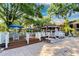 Outdoor patio featuring table seating, umbrellas and a nearby gazebo at 8642 Mallard Reserve Dr # 203, Tampa, FL 33614