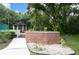 A gazebo with a brick base and a white, wood railing is surrounded by lush green foliage at 8642 Mallard Reserve Dr # 203, Tampa, FL 33614