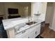 Stylish kitchen featuring stainless steel appliances, granite countertops, and white cabinetry at 8642 Mallard Reserve Dr # 203, Tampa, FL 33614