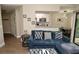 Cozy living room featuring an open layout with a view to the kitchen and dining area at 8642 Mallard Reserve Dr # 203, Tampa, FL 33614