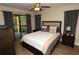 Comfortable bedroom with access to a private balcony and hardwood floors at 8642 Mallard Reserve Dr # 203, Tampa, FL 33614