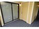 A charming patio featuring a sliding glass door, painted wood siding, and a painted deck at 8642 Mallard Reserve Dr # 203, Tampa, FL 33614