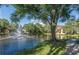 Picturesque pond featuring a fountain and a walking path to the side for morning or afternoon strolls at 8642 Mallard Reserve Dr # 203, Tampa, FL 33614