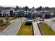 Community center exterior featuring an American flag, fountain, and well-maintained landscaping at 8765 Sentiero Dr, Land O Lakes, FL 34637