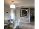 Bright dining area with a modern glass table, white chairs, and natural light, perfect for Gathering meals at 907 Fruitland Ave, Bradenton, FL 34207