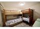 Bedroom featuring wooden bunk beds and a patterned area rug at 9444 Rum Runner Road, Placida, FL 33946