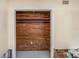 Empty closet featuring wood paneling and need of repair, ready for customization and organization at 100 Buena Vista S Dr, Dunedin, FL 34698