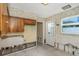 Kitchen featuring vintage cabinets ready for renovation at 100 Buena Vista S Dr, Dunedin, FL 34698
