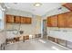 Kitchen with cabinets and backsplash ready for renovation at 100 Buena Vista S Dr, Dunedin, FL 34698