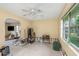 Spacious living room featuring large window and ceiling fan at 100 Buena Vista S Dr, Dunedin, FL 34698